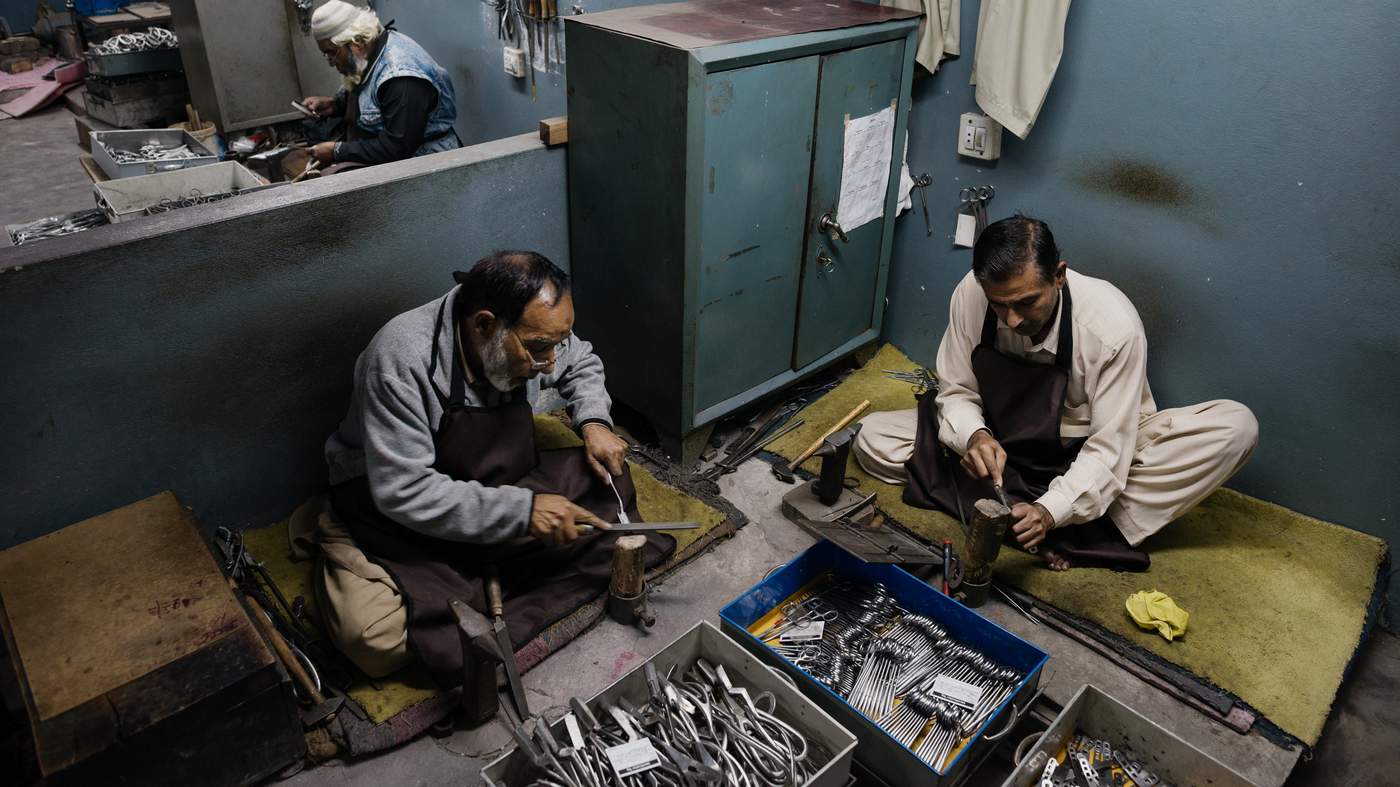 Workers polishing precision medical and beauty instruments at PURE TOUCH INDUSTRY workshop